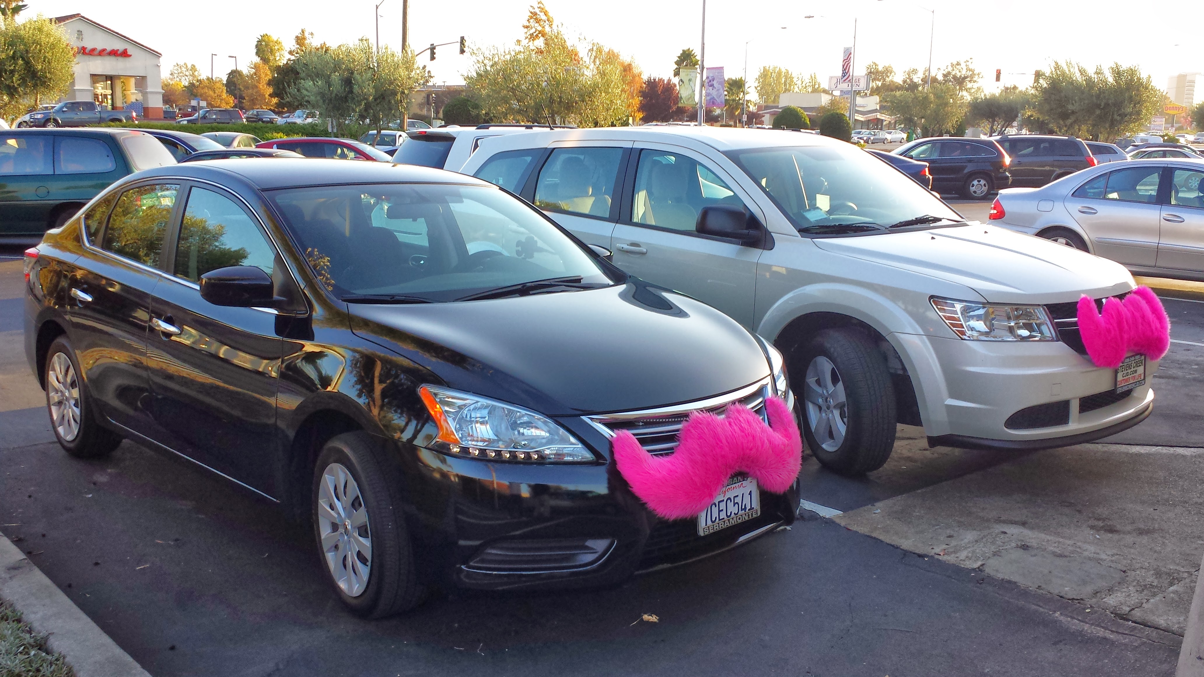 My Nissan Sentra and Dodge Journey with a Lyft mustache